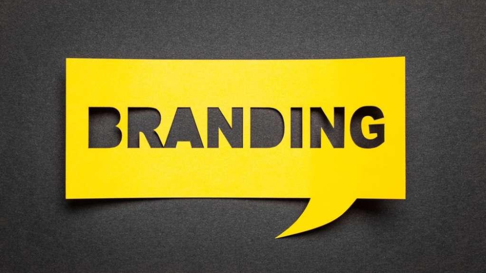 Branding in black letters in yellow cutout - Branding Lessons From Entrepreneurs